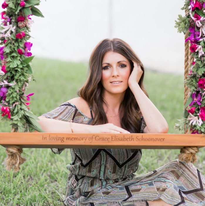Stephanie Schoonover with the swing they dedicated in memory of Grace. Photo by Jenni Dawson of J. Noel Photography.