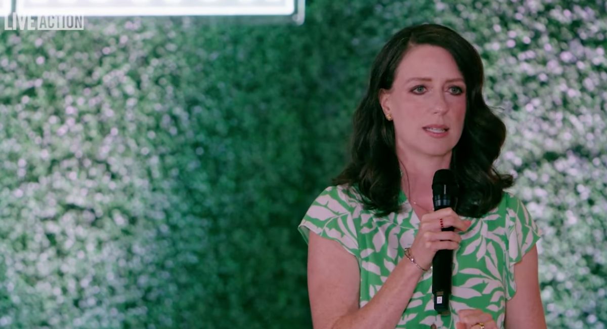 Stephanie Gray Connors speaks to the crowd at Live Action's Women's Summit in June 2025 where she spoke about alleviating suffering without eliminating people.